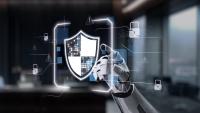 robot hand pointing to screen showing shield with padlocks
